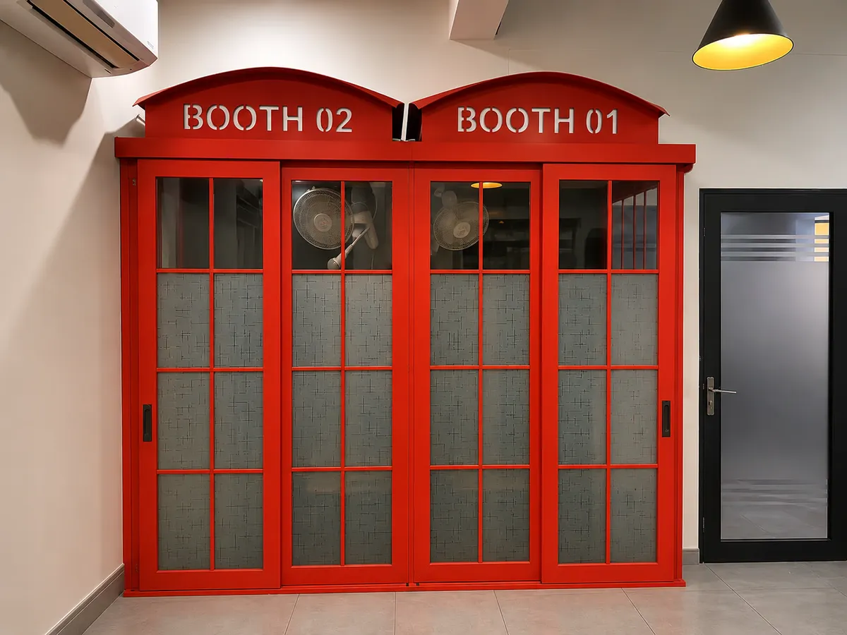 The red calling booths at WorkBench, marked Booth 01 and Booth 02